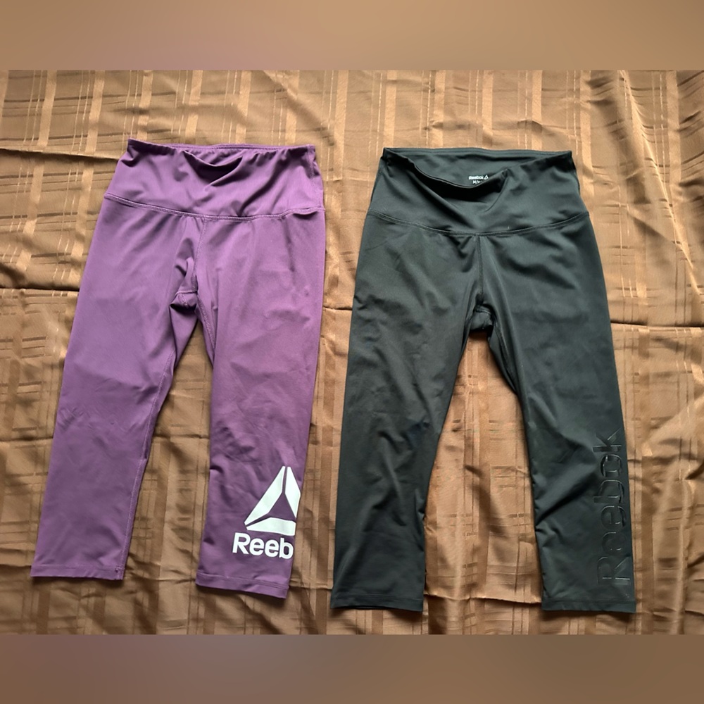 Reebok leggings. One black and one purple. Size Medium